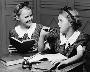 10 11 Years Prints: Two girls (10-11) doing homework (B&W)