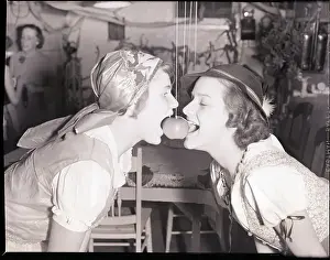 Biting Prints: Girls Biting into Hanging Apple
