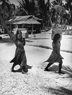 Atomic Prints: Girls Carrying Their Possessions