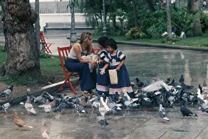 Girls Feeding Pigeons