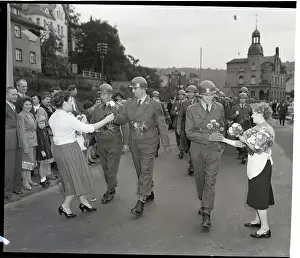 Girls Give Flowers To Troops