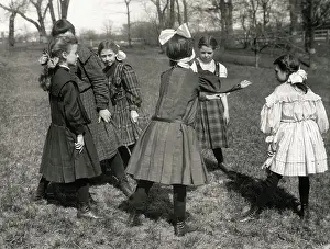Girls Playing Blind Man's Buff Outdoors