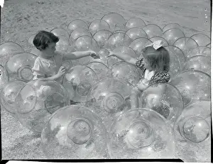 Girls Playing Inside Glass Balls