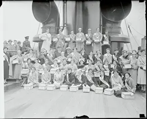 Girls Posing with Boxes Aboard Ship