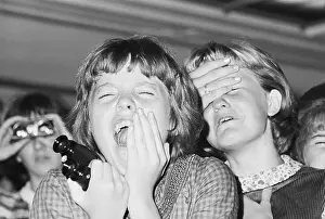 Two Girls Screaming at a Beatles Concert