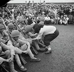 Girls Sewing Seated Soldier's Uniforms