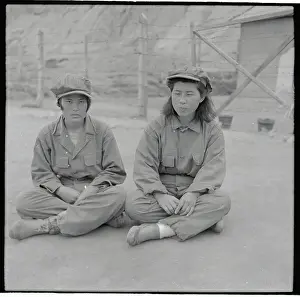 Girls Sitting on Ground