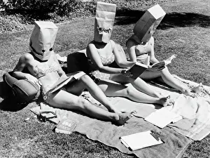 Disguise Prints: Girls Sunbathing with Paper Bags on Heads