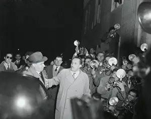 Giuseppe Sotgiu Surrounded by Newsmen