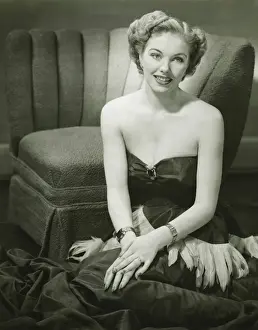 Glamorous woman posing in studio, (B&W), portrait