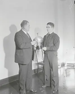 Coach Prints: Glenn Warner Receiving Welcoming Trophy