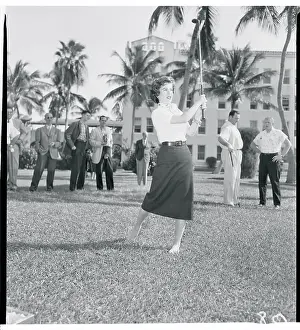 Gloria DeHaven Swinging a Golf Club
