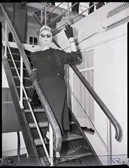 Gloria Graheme Waving On Boat Gangplank