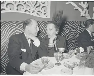 Gloria Swanson and Date Dining