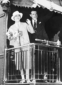 Gloria Swanson and Her Husband Waving