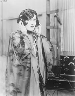 Gloria Swanson Listening to Radio