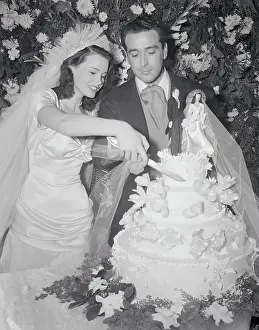 Gloria Vanderbilt DiCicco and Pasquale DiCicco Cutting Wedding Cake