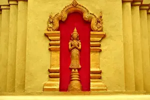Luang Prabang Prints: gold buddhist statue at Wat Xiengleck temple luang prabang Laos Asia