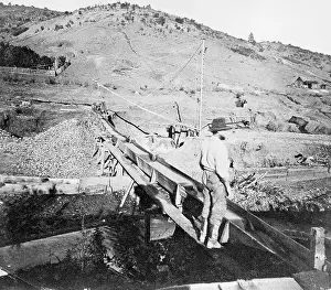 Aqueduct Prints: Gold Miner Standing on Aqueduct