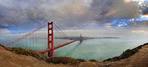 Golden Gate Suspension Bridge Collection: Golden Gate Bridge at sunset with storm clouds, San Francisco, California, United States