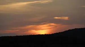 Photograp Prints: Golden sunset falling behind silhouetted hills in the Phinda Private Game Reserve