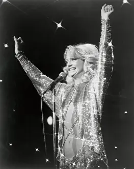 Goldie Hawn Gesturing at Microphone