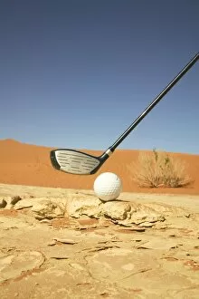 Namibia Collection: Golf Club and Ball on a Barren Desert Floor
