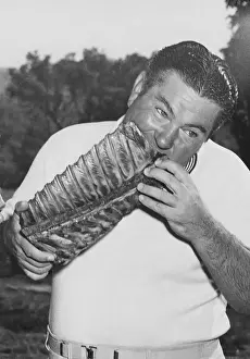 Pork Prints: Golfer Ed Oliver Biting into Long Pork Rib Cage