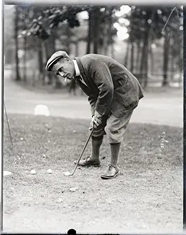 Putting Prints: Golfer H. H. Hilton Smokes While Putting