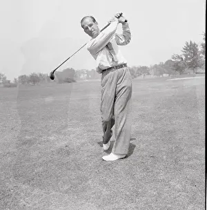 Golfer Swinging Club