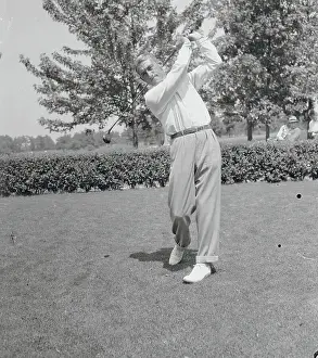 Golfer Swinging Club