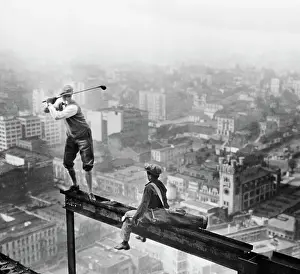 Stunt Prints: Golfer Teeing Off on Girder High Above City