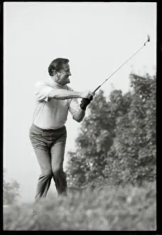 Golfer Tommy Bolt Swinging Club