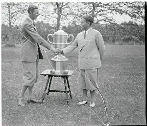 Prints of (Original Caption). The Walker Cup Remains In America. Emblematic of golfing supremacy between America and Britain, the Wallace Cup, was again defended and retained the U. S. stars Swing Through History: Golfers Acknowledging Win