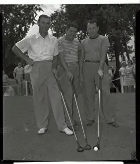 Golfers Standing and Holding Putters