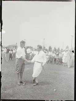 Golfing Competitors Shaking Hands on the Green