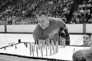 Gordie Howe Blowing Out Candles on Birthday Cake