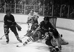 Gordon Howe Helps Defend Goal in Hockey