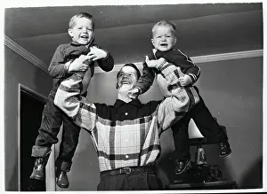 Gordon Howe Holding His Sons in Air