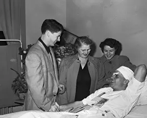 Gordon Howe in Hospital With Visitors