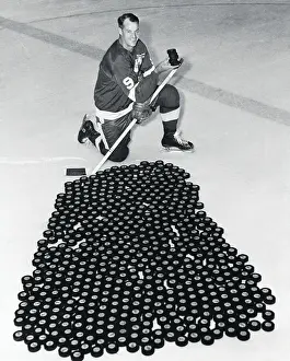 Ice Rink Prints: Gordon Howe on Ice With Hundreds of Pucks