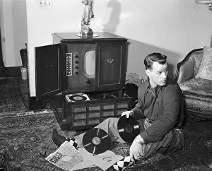 Gordon Howe Seated on Floor With Records