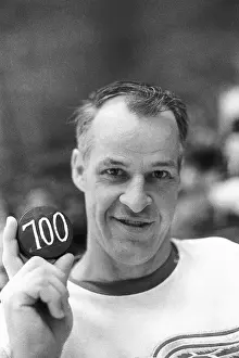 Gordon Howe Smiling With 700th Goal Puck