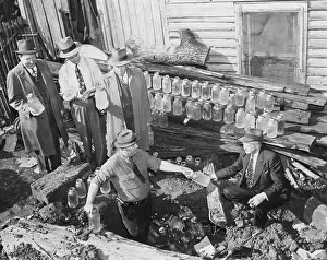 Buried Prints: Government Agents Removing Hidden Moonshine