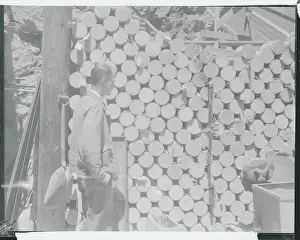 Boulder Prints: Government Worker Examining Cement Collection