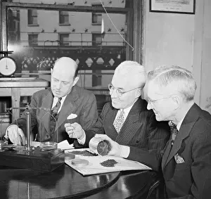 Expert Prints: Government Workers Examining Tea