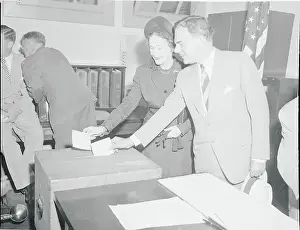 Thomas E Prints: Governor and Mrs. Dewey Casting Ballots