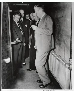 George H Prints: Governor and Officials Examining Solitary Confinement Cell Block