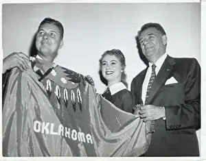Governor and Performers Holding Oklahoma Flag