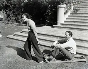 Comedienne Prints: Grace Allen Pulling George Burns on Sled